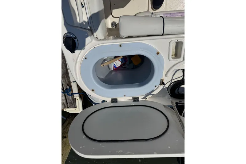 Slide: The Image of Open storage compartment on a 2016 Wellcraft 252 Coastal boat interior. - 23