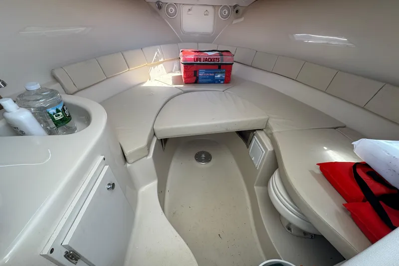Slide: The Image of Interior cabin of 2016 Wellcraft 252 Coastal boat with seating and life jackets. - 31