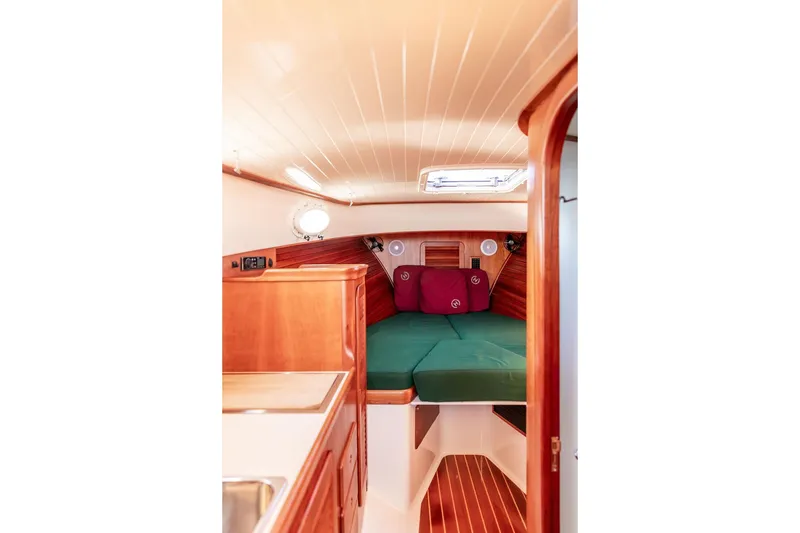 Slide: The Image of Interior of 2000 Hinckley Picnic Boat 36 Classic with cozy cabin and wooden finish. - 14