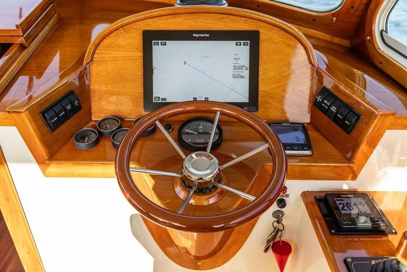 Slide: The Image of Steering wheel and navigation controls of a 2000 Hinckley Picnic Boat 36 Classic. - 7