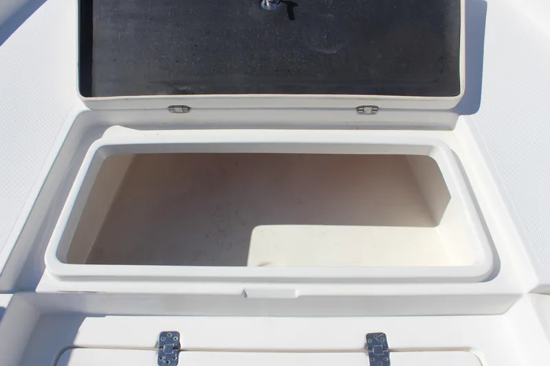 Slide: The Image of Open storage compartment on a 2022 NauticStar 227 Bay boat. - 23