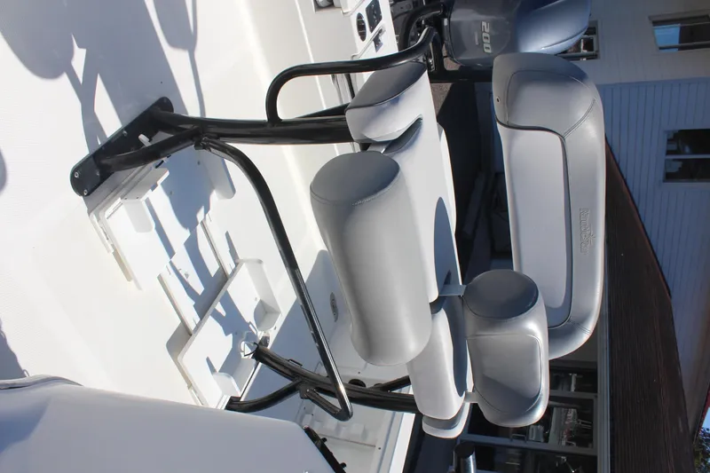 Slide: The Image of 2022 NauticStar 227 Bay boat seating and console detail. - 30
