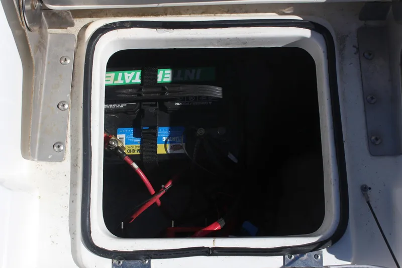 Slide: The Image of Battery compartment of 2022 NauticStar 227 Bay boat with visible wiring. - 33