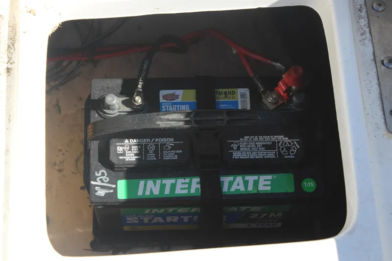 Slide: The Image of Battery compartment of a 2022 NauticStar 227 Bay boat with Interstate marine battery. - 35