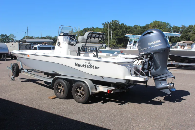 Slide: The Image of 2022 NauticStar 227 Bay boat on trailer with Yamaha outboard motor. - 8