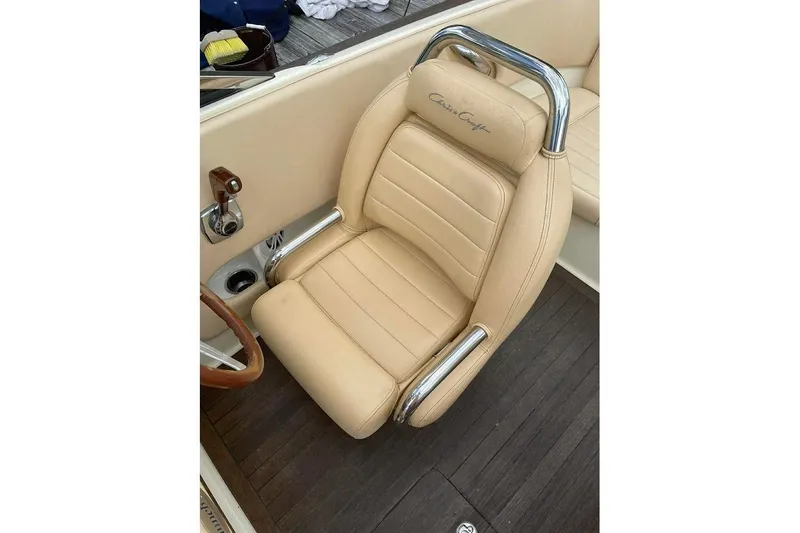 Slide: The Image of Luxurious beige seat in 2011 Chris-Craft Launch 22 Heritage Edition boat, featuring chrome accents. - 13