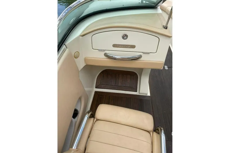 Slide: The Image of 2011 Chris-Craft Launch 22 Heritage Edition interior with beige seating and wood accents. - 16
