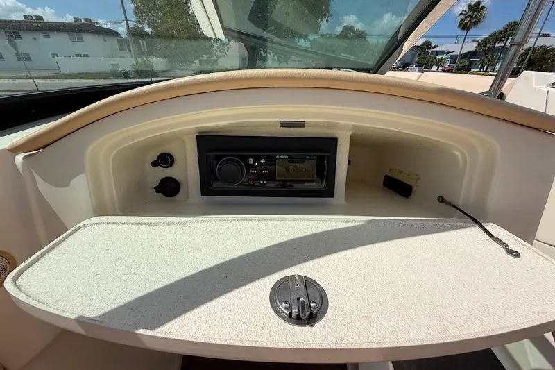 Slide: The Image of 2011 Chris-Craft Launch 22 Heritage Edition dashboard with stereo system and controls. - 18