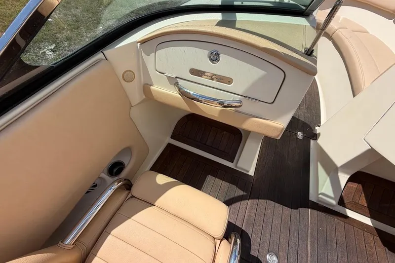 Slide: The Image of 2011 Chris-Craft Launch 22 Heritage Edition interior with beige leather and wood accents. - 19