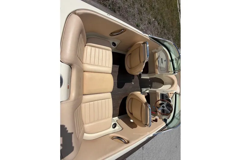 Slide: The Image of 2011 Chris-Craft Launch 22 Heritage Edition interior with tan leather seats and wooden accents. - 20