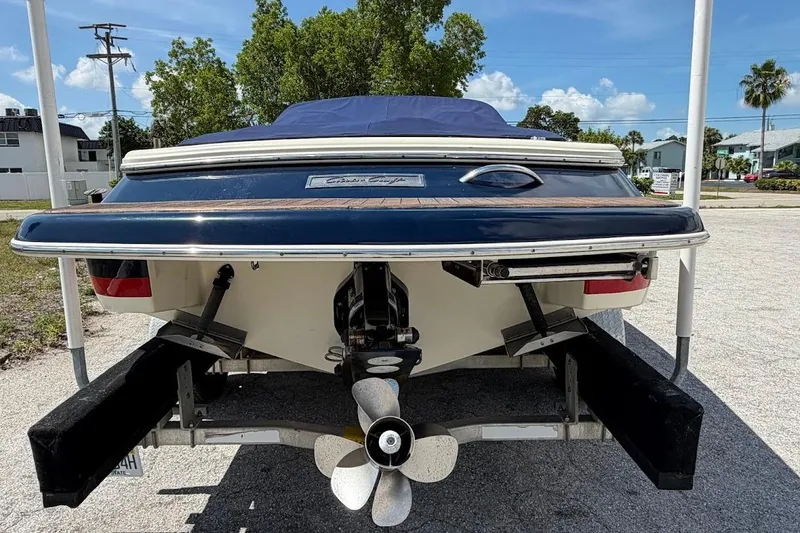 Slide: The Image of 2011 Chris-Craft Launch 22 Heritage Edition boat rear view on trailer. - 22