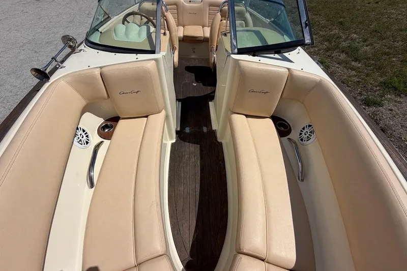 Slide: The Image of 2011 Chris-Craft Launch 22 Heritage Edition boat interior with beige seating and wood accents. - 8