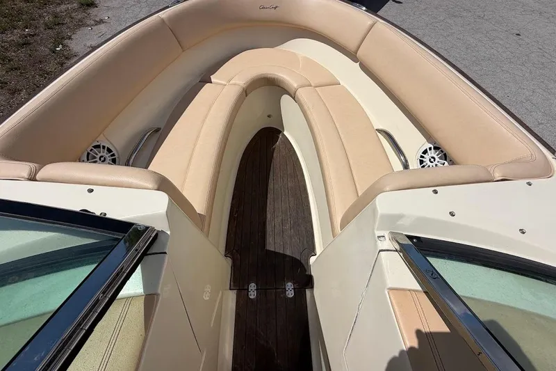 Slide: The Image of 2011 Chris-Craft Launch 22 Heritage Edition boat interior with beige seating and wood flooring. - 9