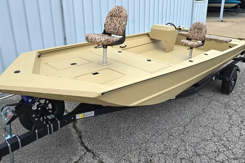 The Image of 2026 Lowe Roughneck RX2070 Tiller boat with camo seats on a trailer. - 0