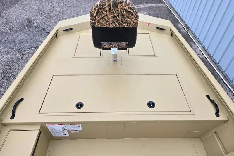 Slide: The Image of 2026 Lowe Roughneck RX2070 Tiller boat deck with camo seat and storage compartments. - 4