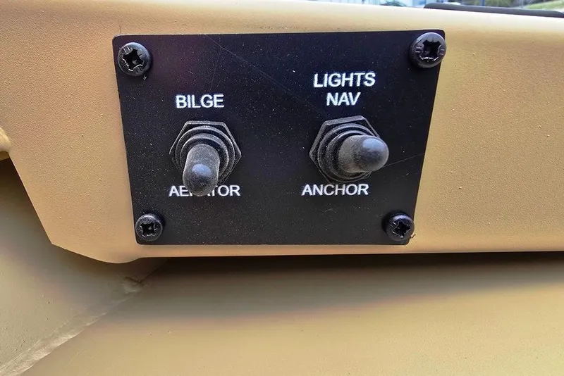 Slide: The Image of Control panel of Lowe Roughneck RX2070 Tiller 2026 with bilge and lights switches. - 8