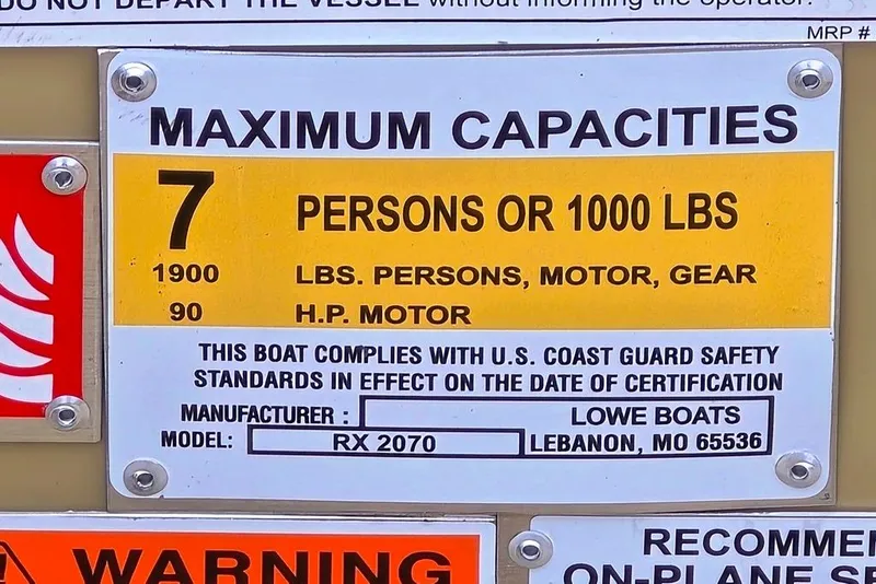 Slide: The Image of Maximum capacity sign for Lowe Roughneck RX2070 Tiller, 7 persons or 1000 lbs, 90 HP motor. - 9