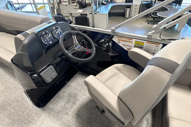 Slide: The Image of 2027 Premier 200 Sunscape RL - CL boat interior with steering wheel and seating. - 14