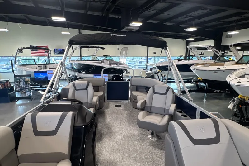 Slide: The Image of 2027 Premier 200 Sunscape RL - CL pontoon boat displayed in a showroom. - 15