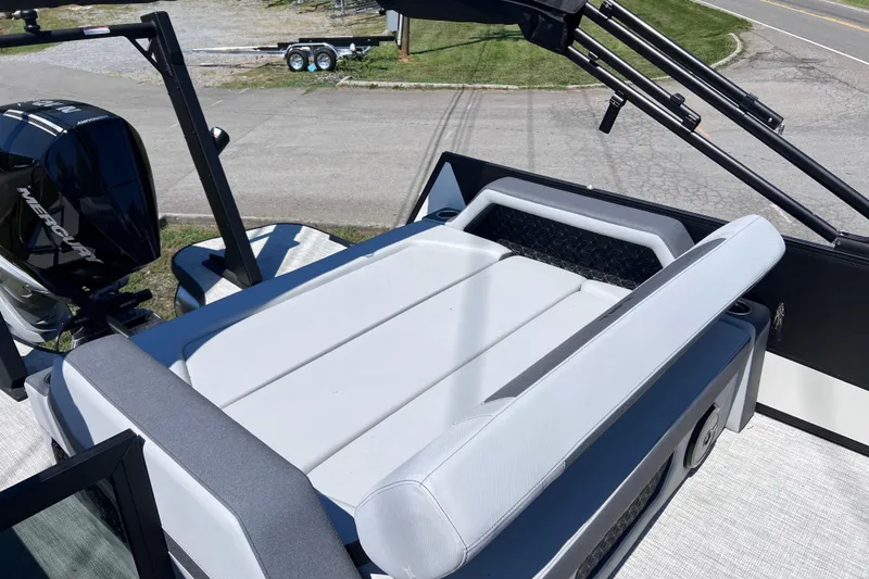 Slide: The Image of Alera M23L 2026 boat with Mercury engine, featuring a sleek white seating area. - 13