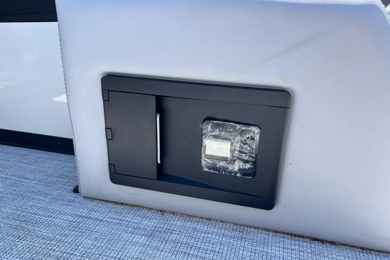 Slide: The Image of Control panel on Alera M23L boat, 2026 model, with protective cover. - 15