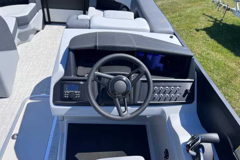 Slide: The Image of Cockpit of 2026 Alera M23L boat with steering wheel and control panel. - 4