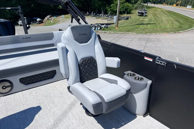Slide: The Image of Luxury seating on Alera M23L boat, 2026 model, featuring cup holders and modern design. - 9