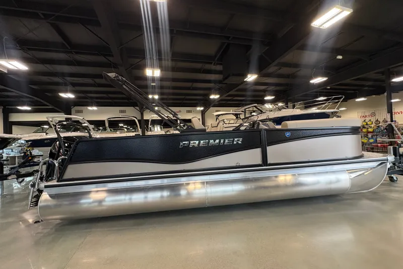 The Image of 2027 Premier 220 Sunscape RL - CL pontoon boat displayed indoors. - 1
