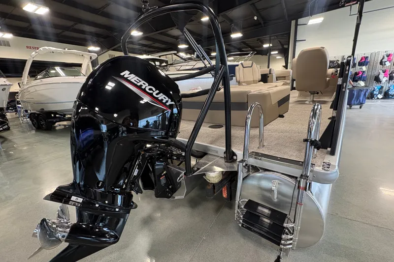 Slide: The Image of 2027 Premier 220 Sunscape RL - CL pontoon boat with Mercury outboard motor in showroom. - 4