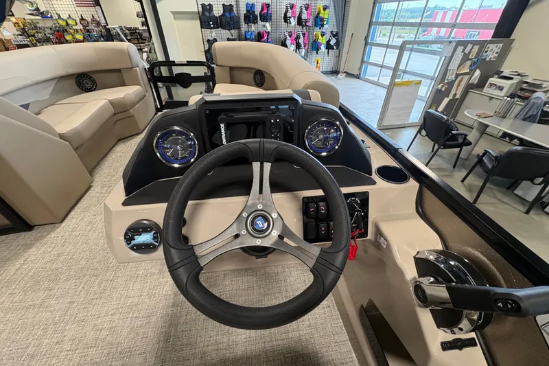 Slide: The Image of Interior view of 2027 Premier 220 Sunscape RL - CL boat, featuring steering wheel and dashboard. - 3