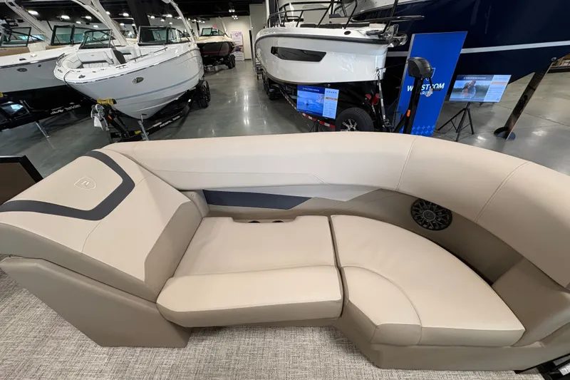 Slide: The Image of Luxurious seating on the 2027 Premier 220 Sunscape RL - CL boat in showroom. - 7