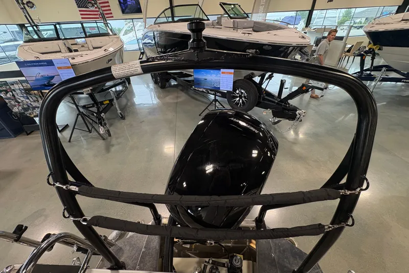 Slide: The Image of 2027 Premier 220 Sunscape RL - CL boat displayed in showroom with other boats. - 5