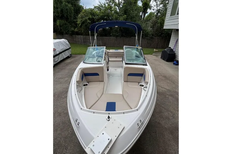 Slide: The Image of 2012 Chaparral 19 H2O Ski & Fish boat with open bow seating and blue accents. - 2