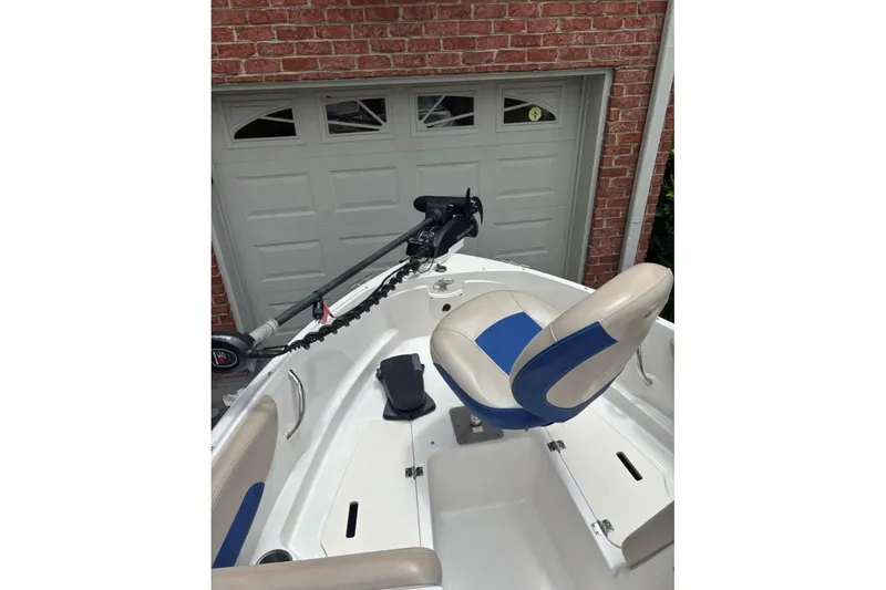 Slide: The Image of 2012 Chaparral 19 H2O Ski & Fish boat interior with blue and white seating. - 3