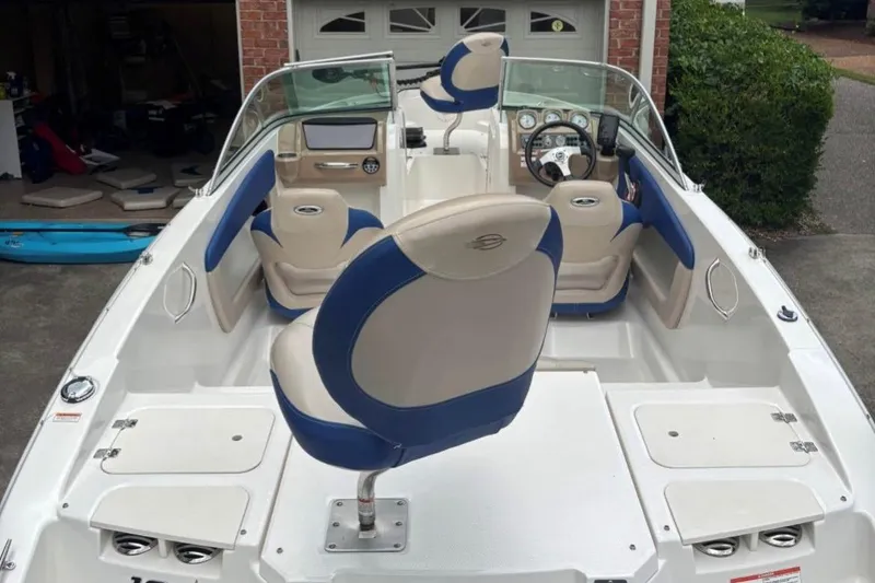 Slide: The Image of 2012 Chaparral 19 H2O Ski & Fish boat interior with blue and beige seating. - 4