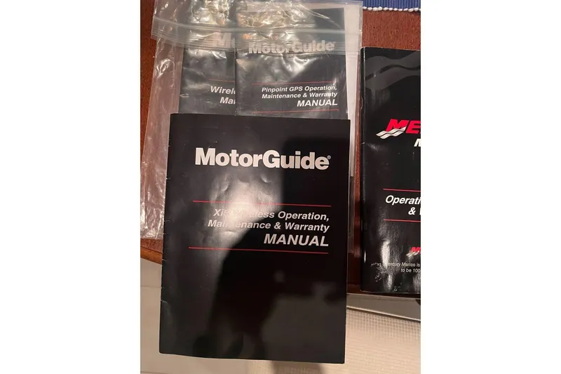 Slide: The Image of Manuals for MotorGuide and GPS operation, maintenance, and warranty for Chaparral 19 H2O Ski & Fish 2012. - 8