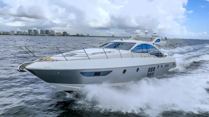 The Image of 2008 Azimut 62S yacht cruising on open water under a cloudy sky. - 1
