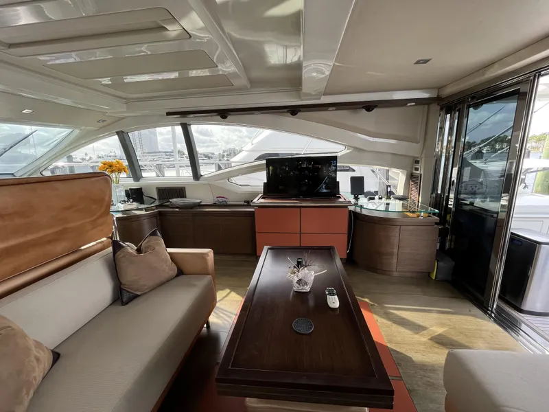 Slide: The Image of Luxurious interior of a 2008 Azimut 62S yacht with elegant seating and modern amenities. - 11