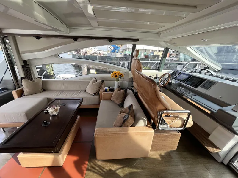 Slide: The Image of Luxurious interior of a 2008 Azimut 62S yacht with elegant seating and helm. - 13