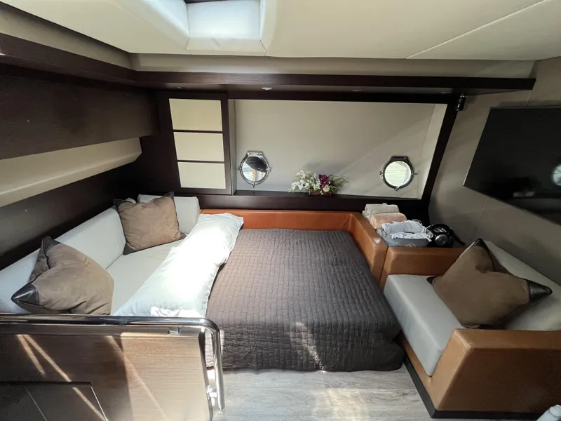 Slide: The Image of Luxurious interior of a 2008 Azimut 62S yacht with elegant bedding and modern decor. - 21