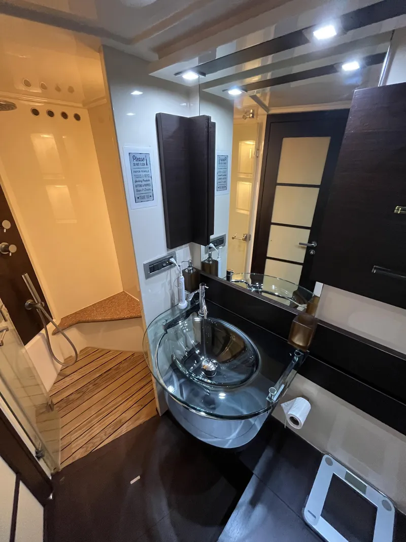 Slide: The Image of Luxurious bathroom in 2008 Azimut 62S yacht with modern glass sink and elegant wood accents. - 30
