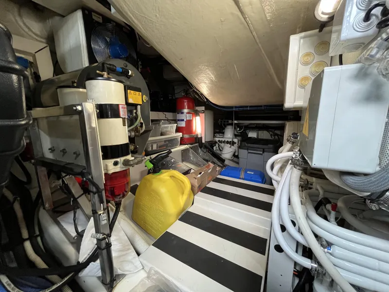 Slide: The Image of Engine room of a 2008 Azimut 62S yacht, featuring equipment and storage. - 41