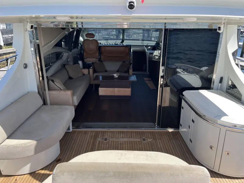 Slide: The Image of Luxurious interior of a 2008 Azimut 62S yacht with elegant seating and modern design. - 9