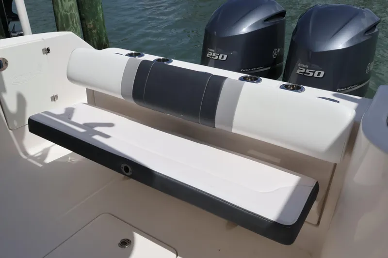 Slide: The Image of 2020 Robalo R272 Center Console boat with Yamaha 250 engines and cushioned seating. - 11