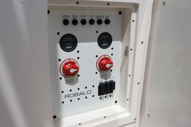 Slide: The Image of Control panel of 2020 Robalo R272 Center Console boat with engine and house power switches. - 13