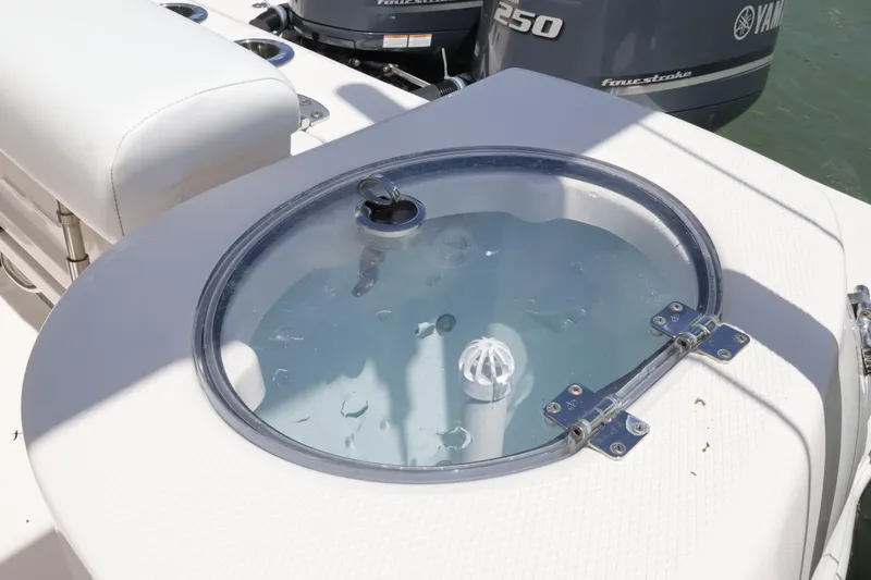 Slide: The Image of 2020 Robalo R272 Center Console boat with livewell and Yamaha outboard engine. - 14