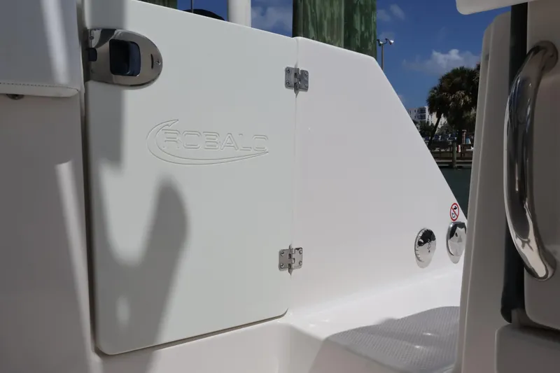 Slide: The Image of 2020 Robalo R272 Center Console boat interior with logo and hatch detail. - 15