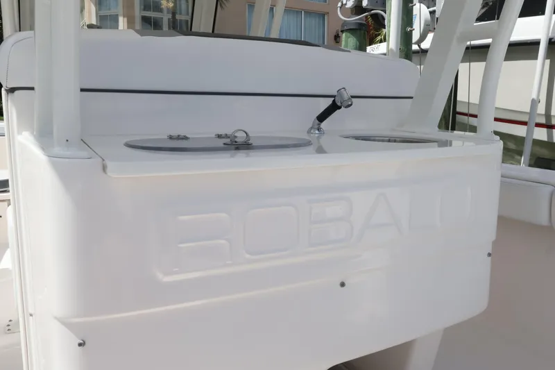 Slide: The Image of 2020 Robalo R272 Center Console boat with dual livewells and faucet. - 18