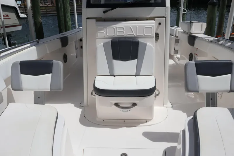 Slide: The Image of 2020 Robalo R272 Center Console boat interior with cushioned seating and sleek design. - 32