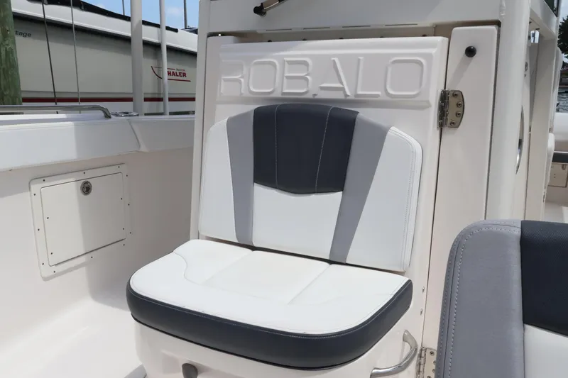 Slide: The Image of 2020 Robalo R272 Center Console boat seat with stylish white and gray upholstery. - 35